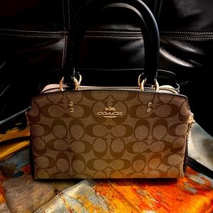 Coach purse with handles & strap.